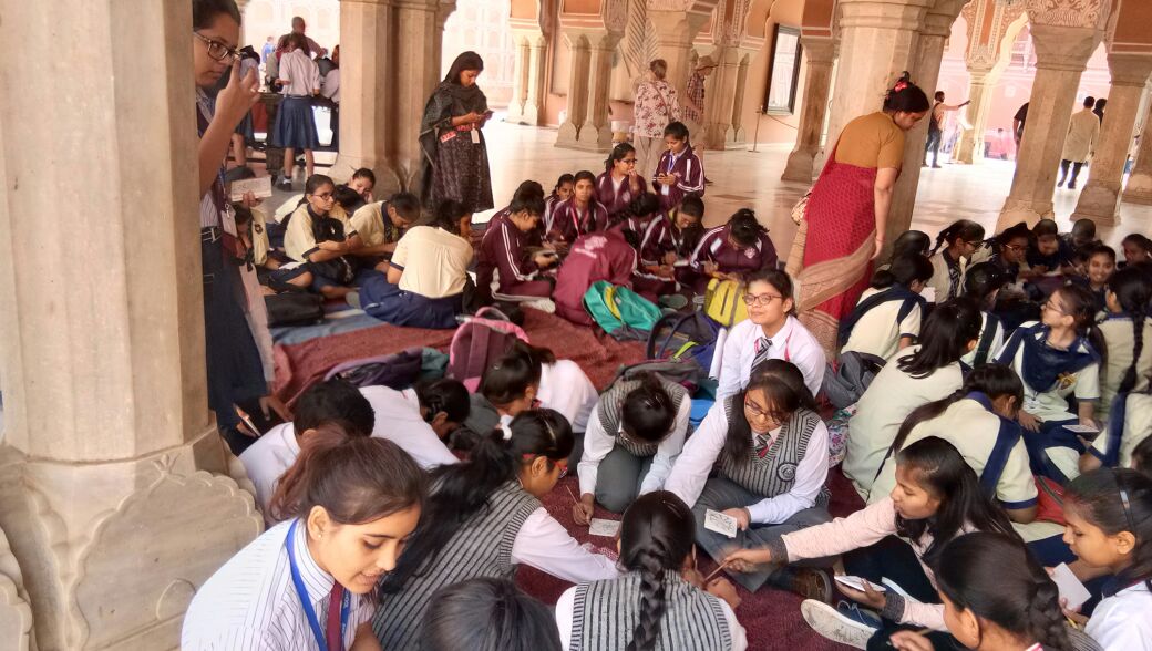 Children's trying their hands on blue pottery