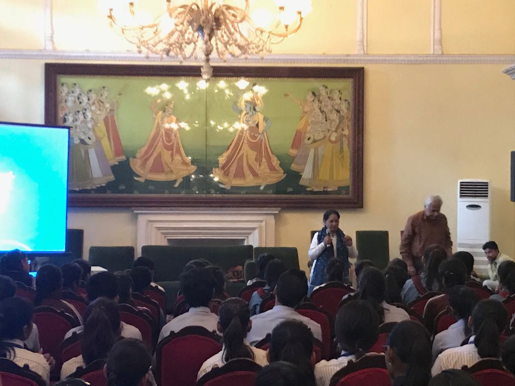 Children watching the short film on history of blue pottery