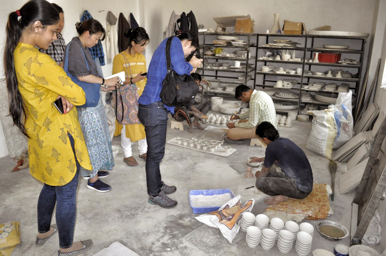 Group interacting with artisans