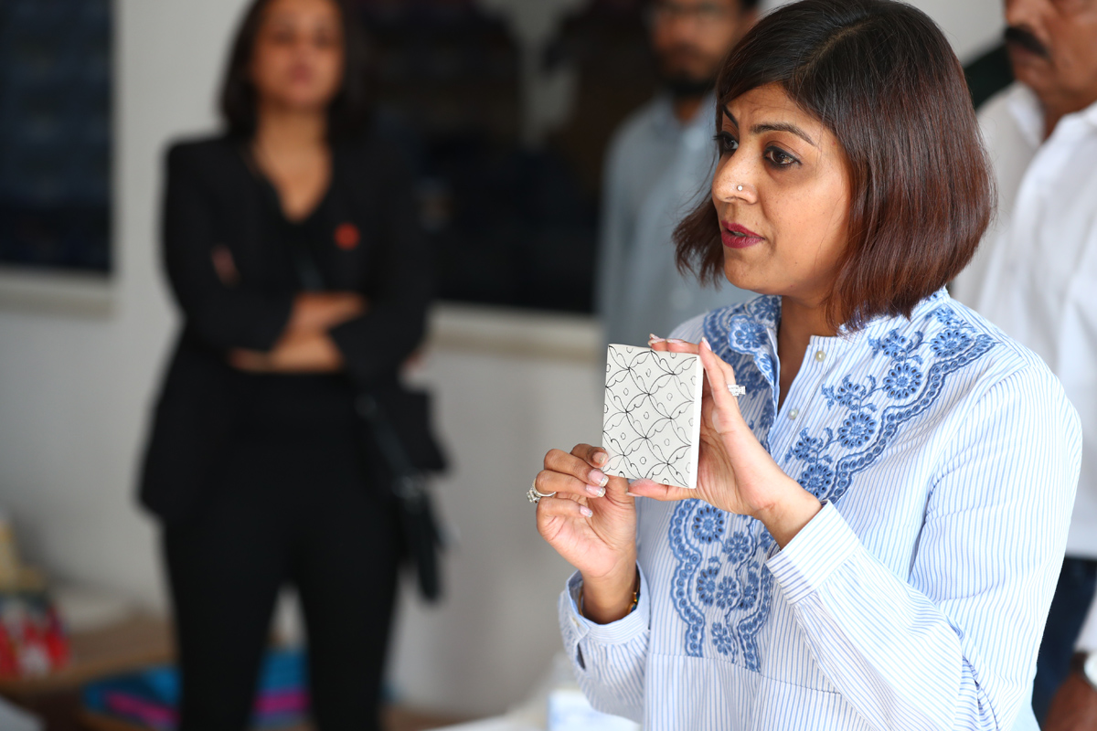 Nupur Bordia explaining the process and making of blue pottery