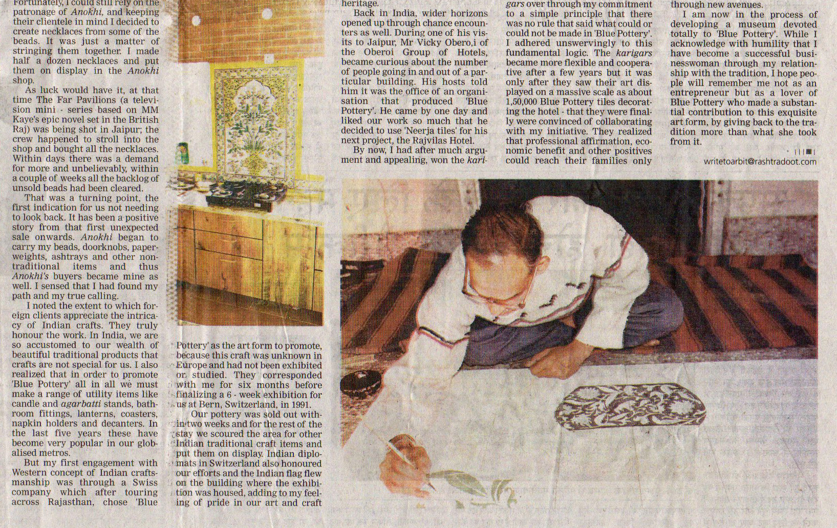 Artisan designing the blue pottery panel