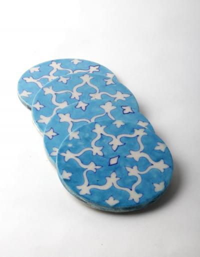 White Geometric Design on Turquoise Coaster