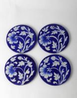 White Floral Design on Blue Coasters